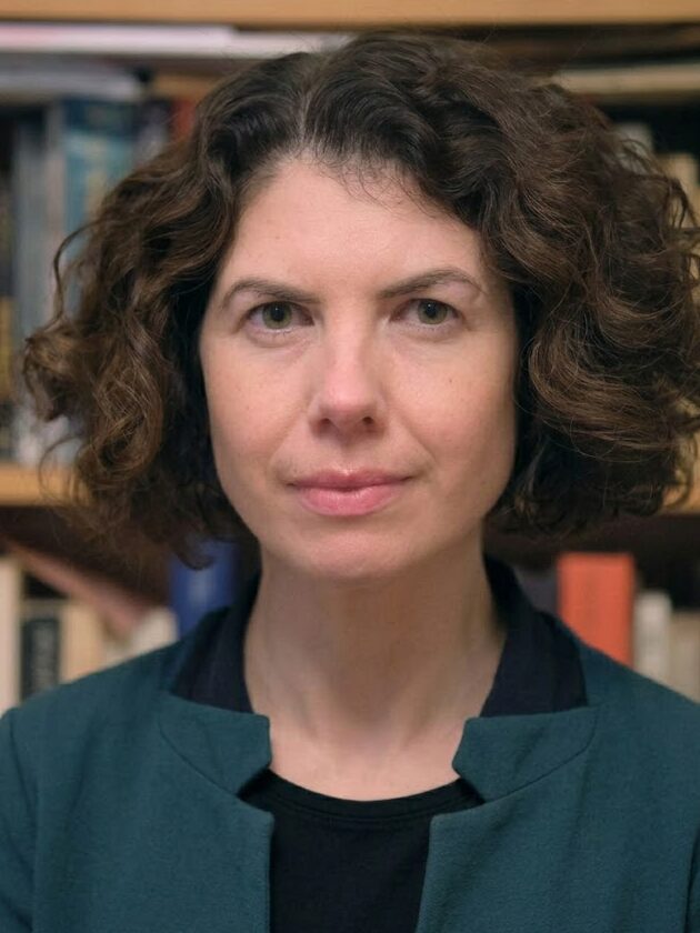 Photo of Niamh McGuigan, who has short, brown, curly hair. 